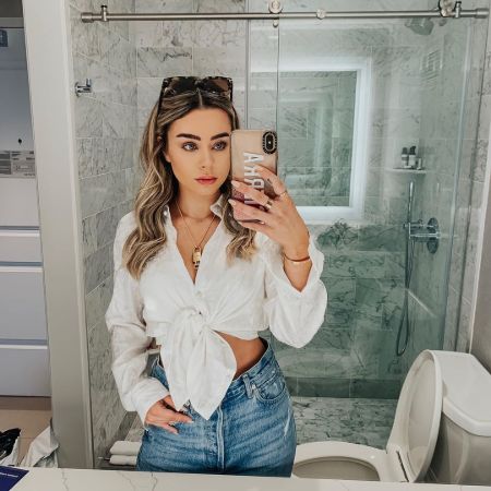 Sierra Furtado Boyfriend: she is in a white top poses for a mirror selfie.